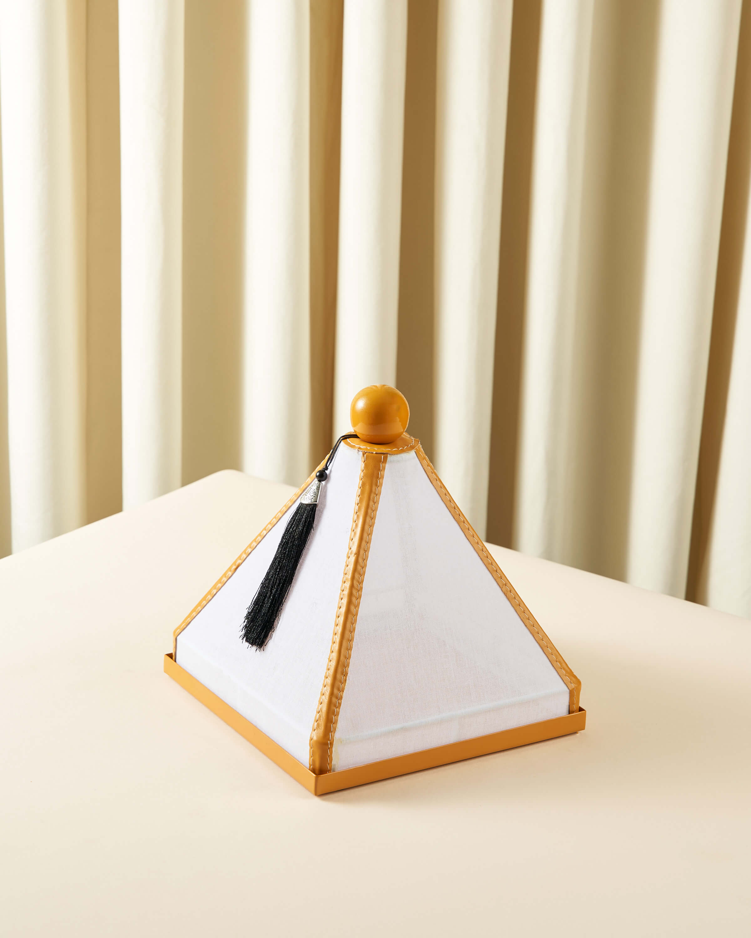 Serving dish with a raw lid and square leather cover
