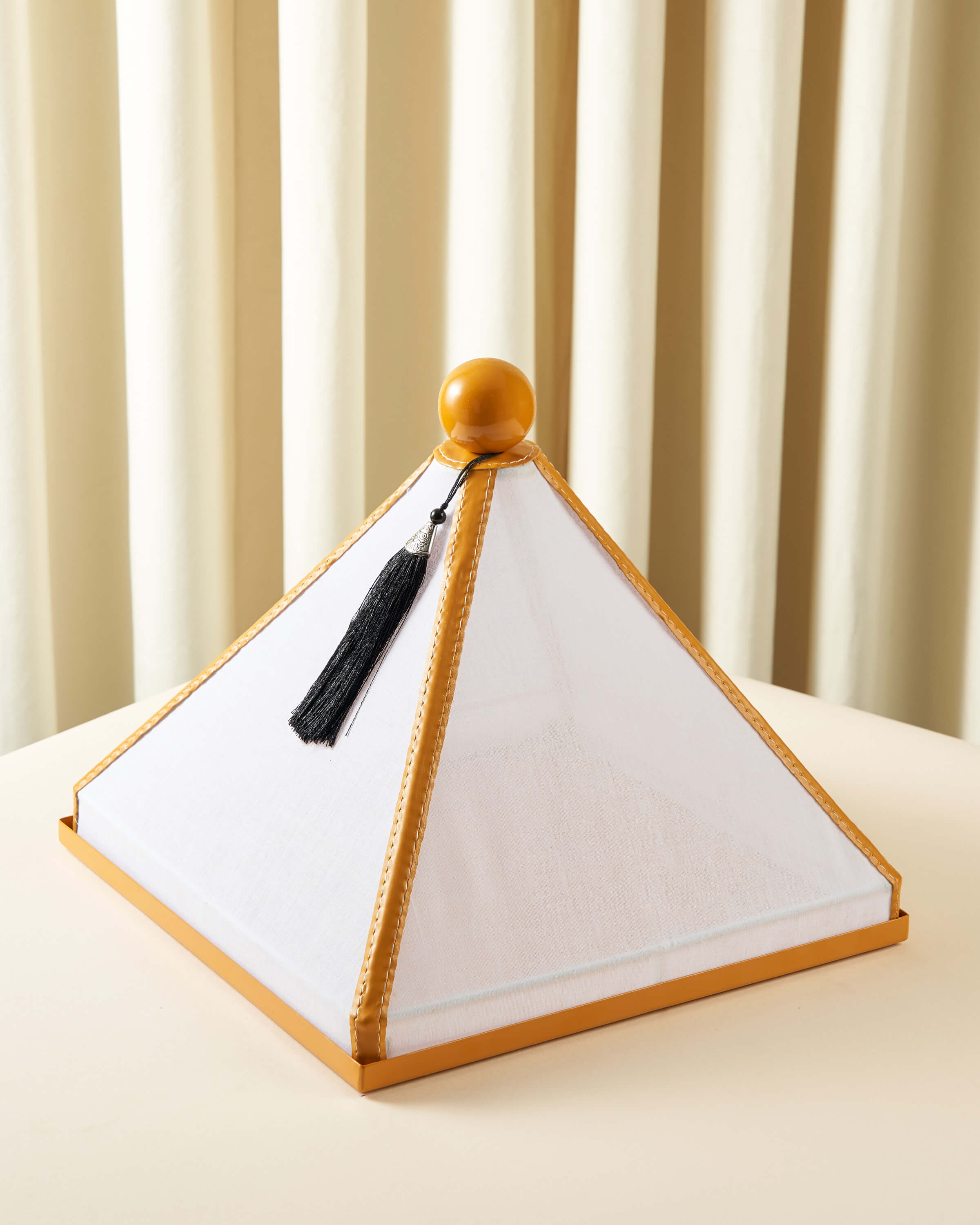 Serving dish with a raw lid and square leather cover